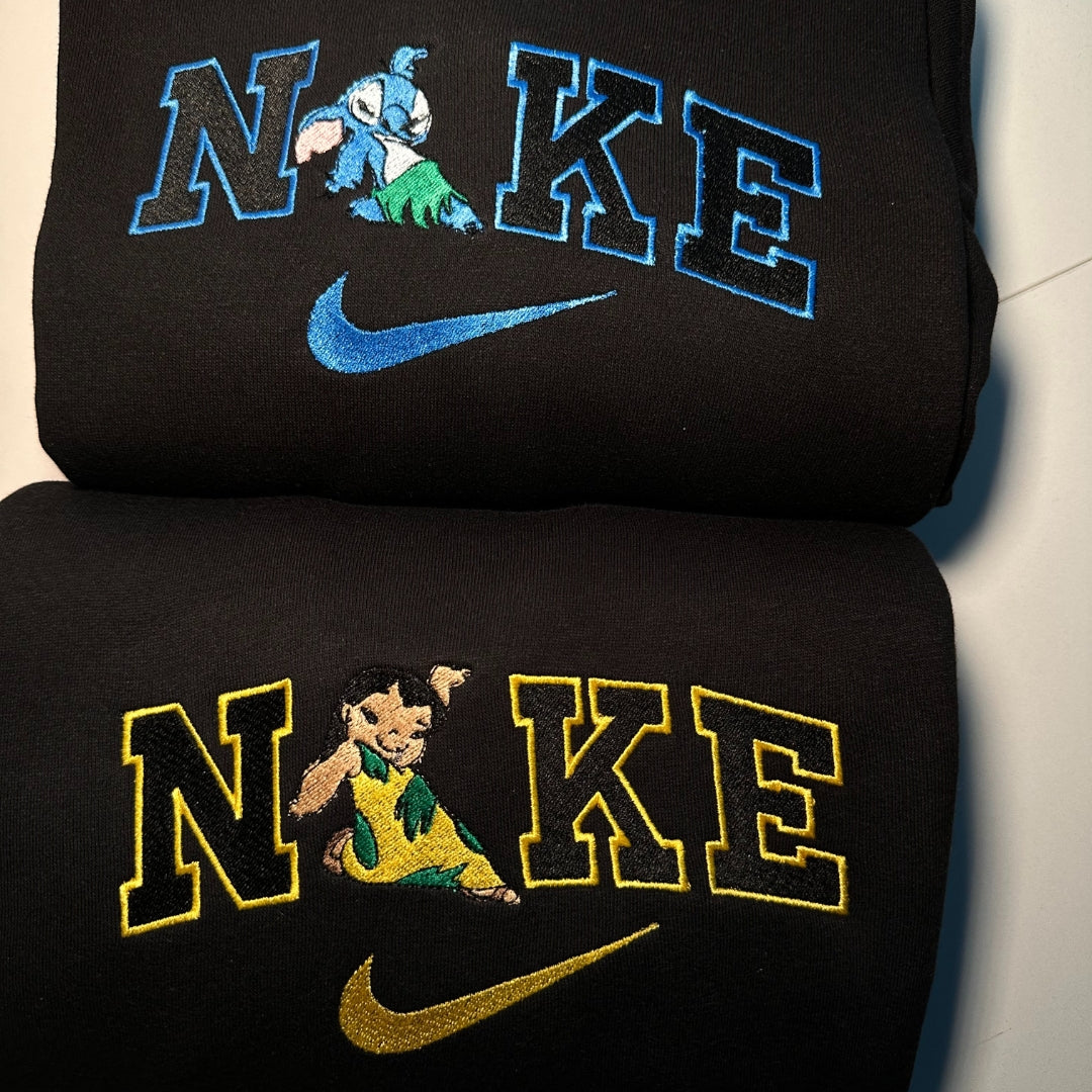 Black custom embroidered couple shirts with playful cartoon designs and colorful Nike-style logos
