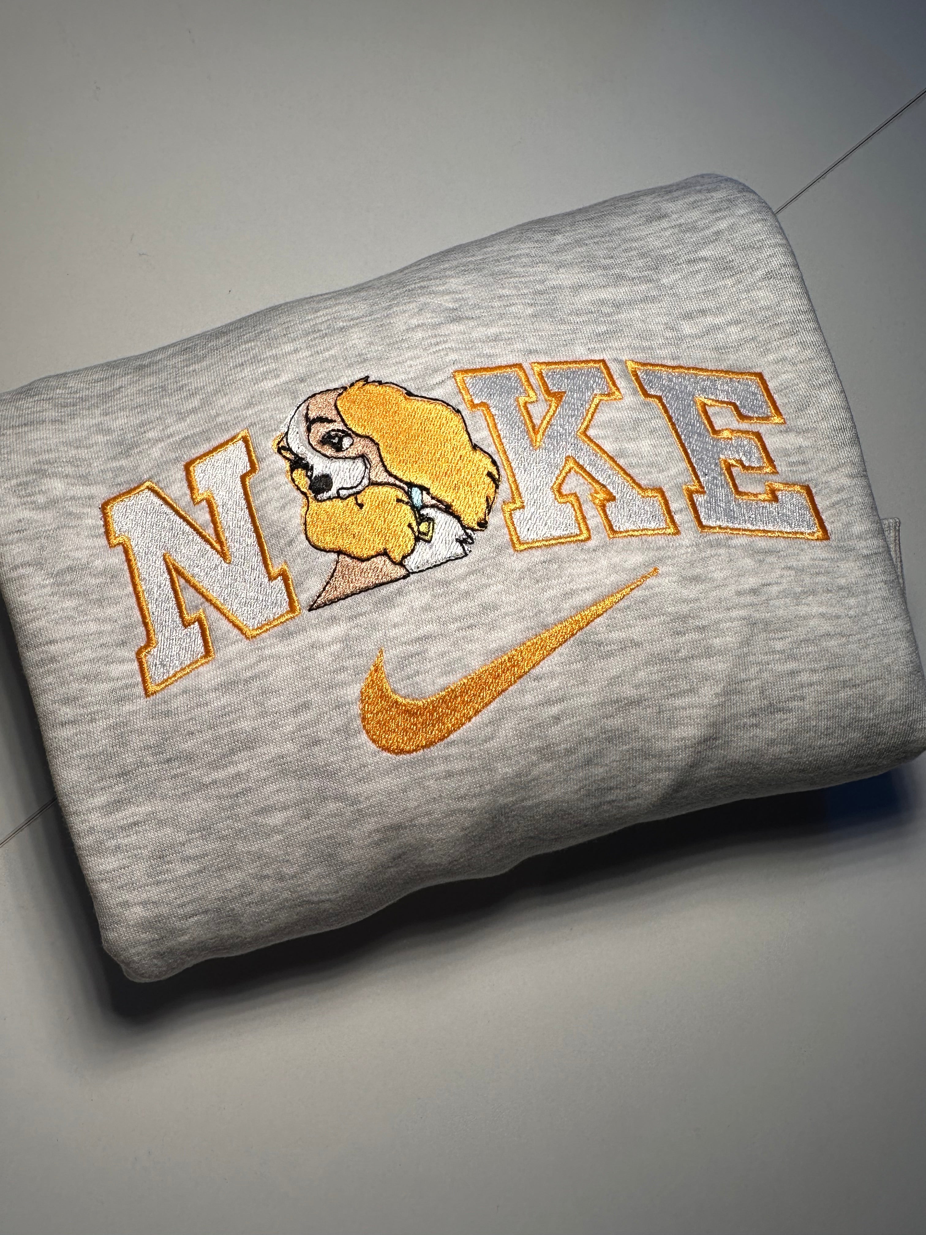 Gray Nike sweatshirt featuring La Belle et le Clochard matching sweatshirts design with cartoon dog embroidery